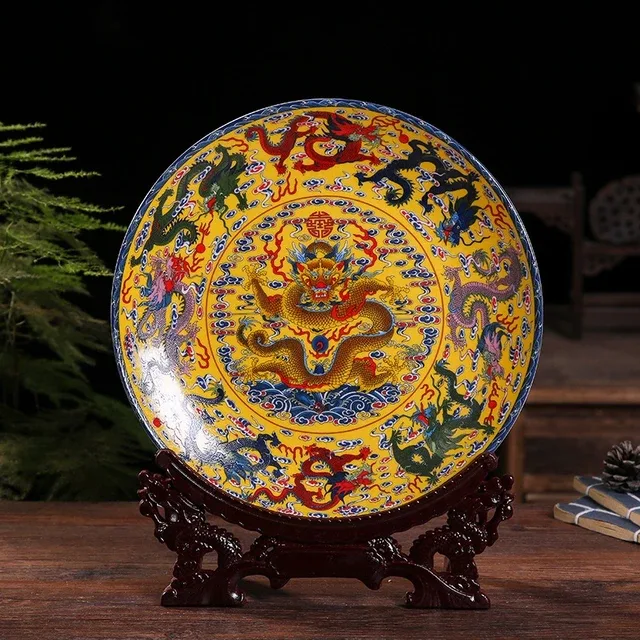 A yellow display plate presents a central dragon within a densely patterned blue and red border