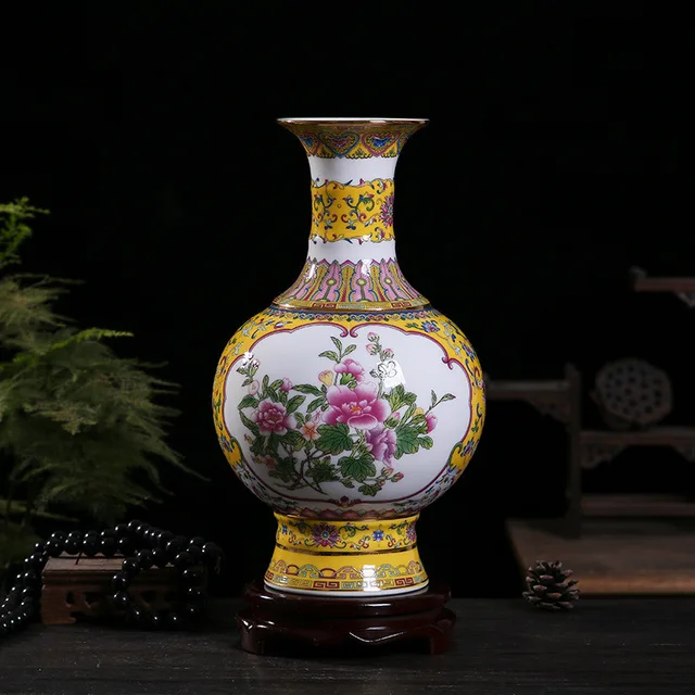 The pictured vase has a rounded body with floral panels and yellow patterned borders around the neck and foot