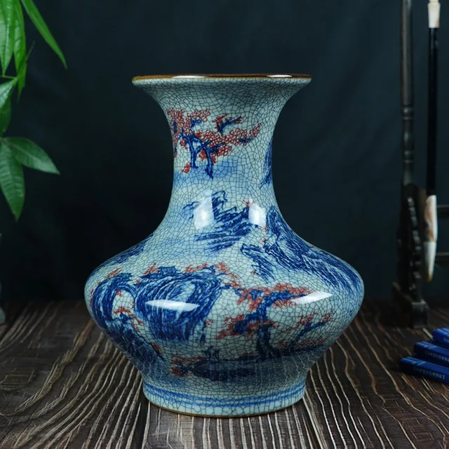 A blue landscape wraps around the broad body of the pictured crackle-patterned vase