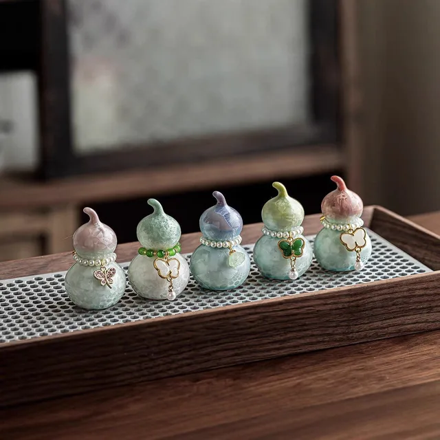 Small gourd-shaped tea ornaments have softly blended colors and rounded lobes