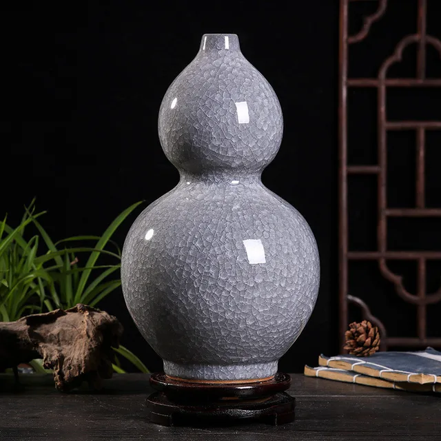 The pictured grey vase has two rounded gourd lobes covered in a fine crackle pattern