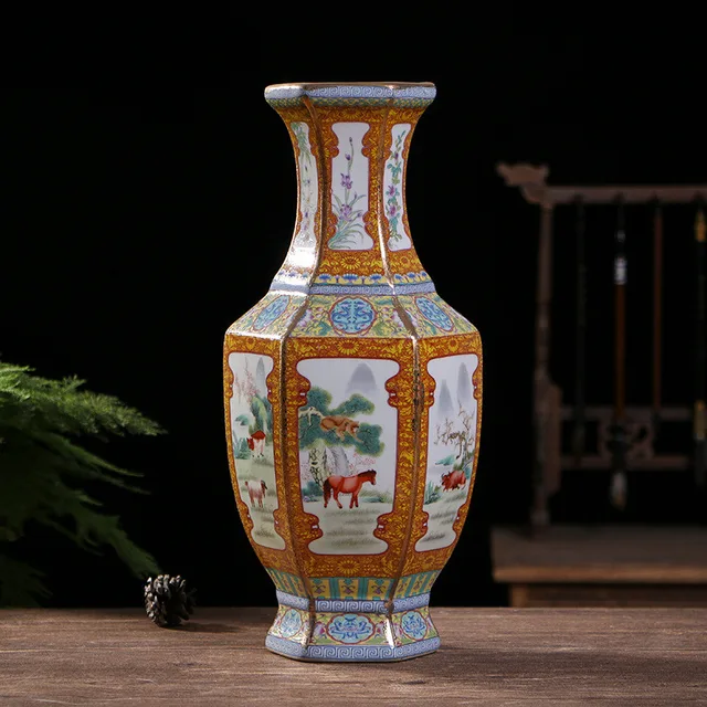 A hexagonal vase frames zodiac-themed scenes in pale panels bordered by orange and blue decoration