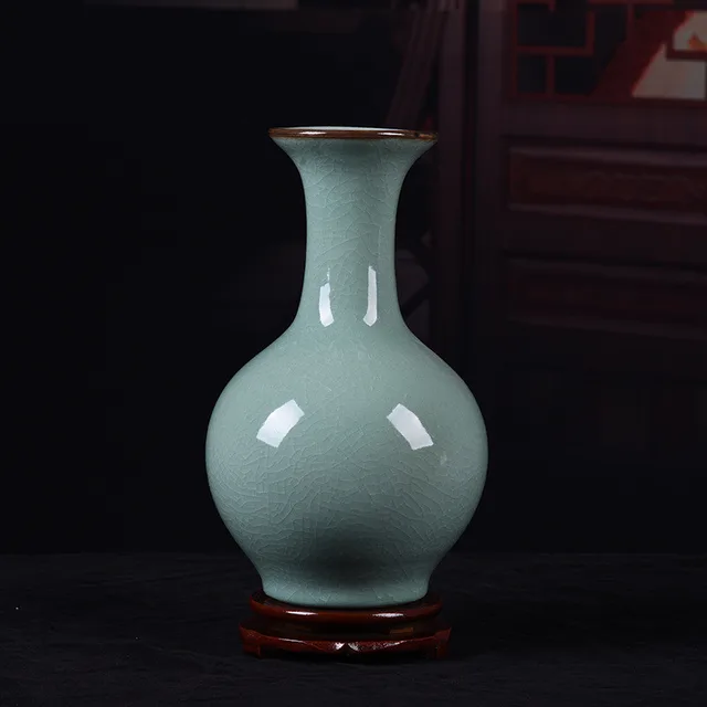 The pictured pale green vase has a rounded body, slender neck and plain glazed surface