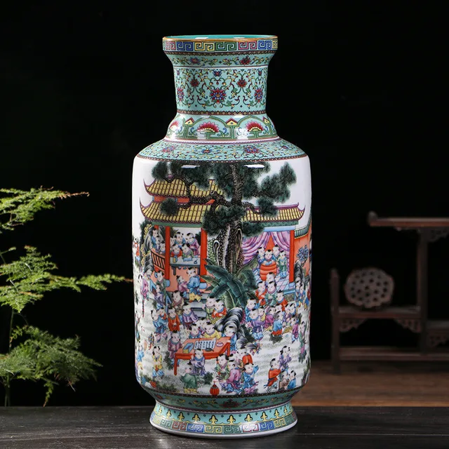 A tall vase presents colorful scenes of children at play beneath patterned green borders