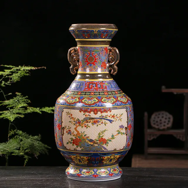 A double-handle vase has floral and bird panels against a purple ground with gold-tone details